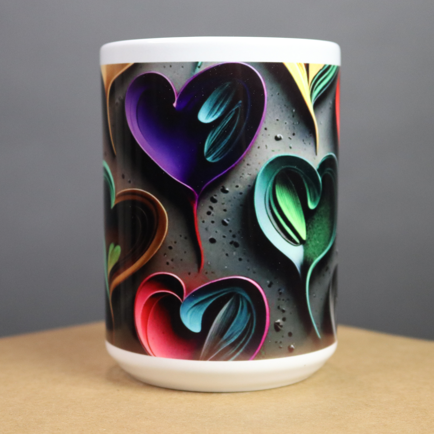 Mug with colorful heart design on a dark background