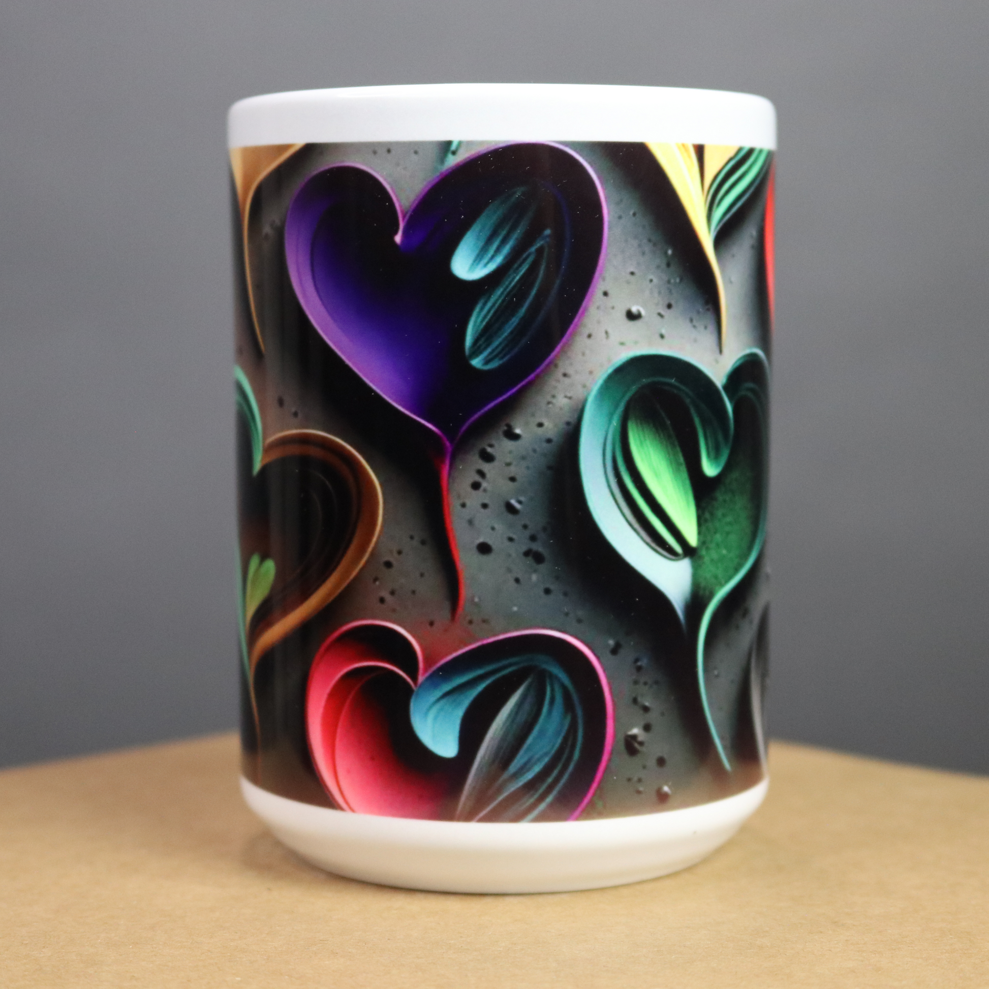 Mug with colorful heart design on a dark background