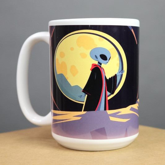 Mug with alien design on a black, red, green and yellow background background