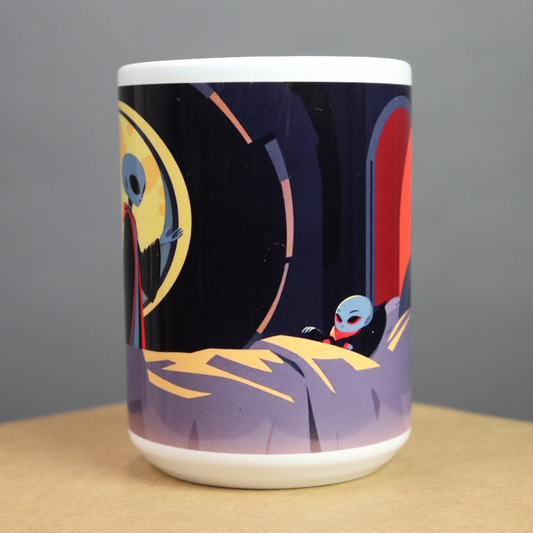 Mug with a colorful alien design on a black, red, green and yellow  background